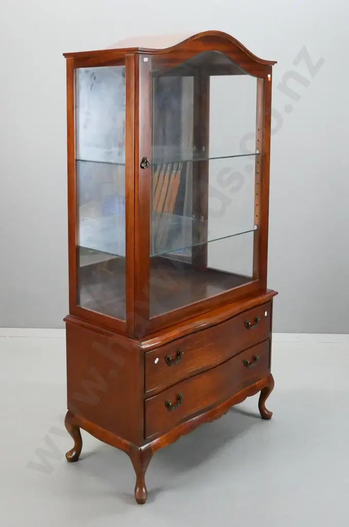 reproduction mahogany display cabinet with shaped top, glazed sides, 2 glass shelves and mirror back, 2 shaped lower Image 1++