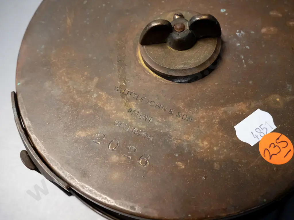 vintage brass and steel measuring tape with leather strap, marked W. Littlejohn & Son Wellington and a cast brass tap Image 1++