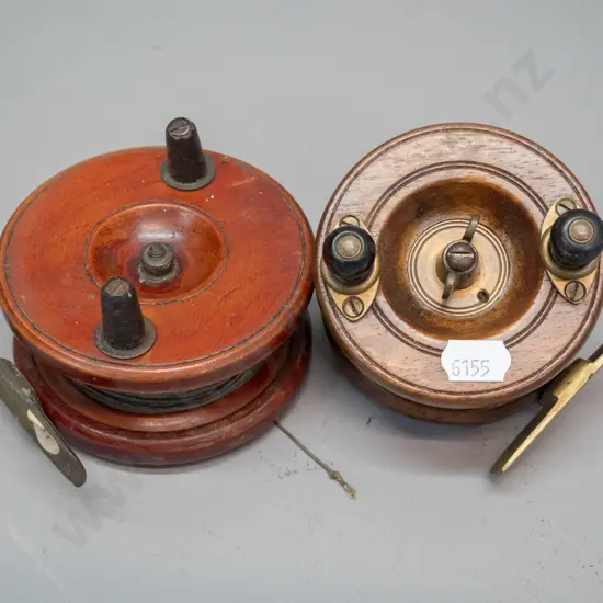 2 timber and brass fishing reels, smaller 3-inch one marked Wilkes Osprey Brand - Made in England, larger is D-90