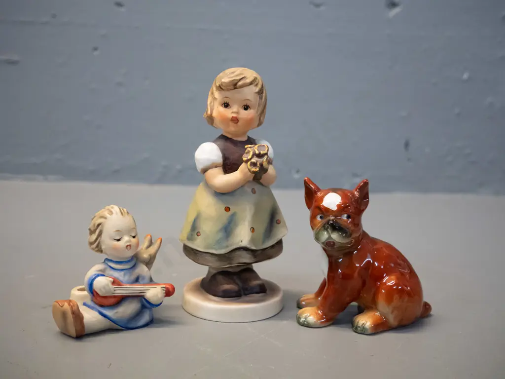 3 Goebels figurines - girl with posie H-130, angel with stringed instrument and high glaze boxer puppy Image 1++