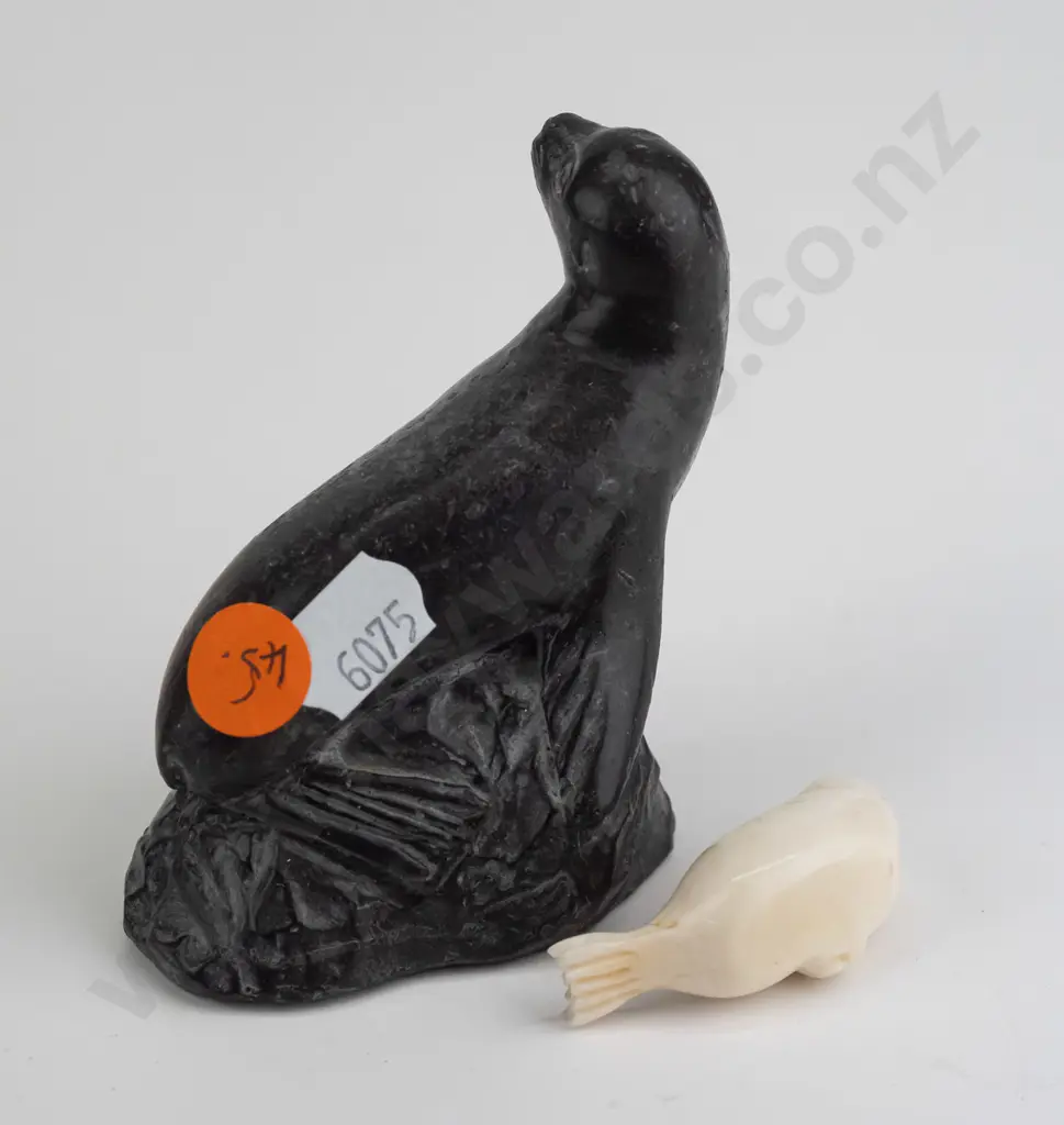small carved bone? seal figure marked Robert Apatiki on base, and a carved black soapstone seal made in Canada H-80 Image 1++