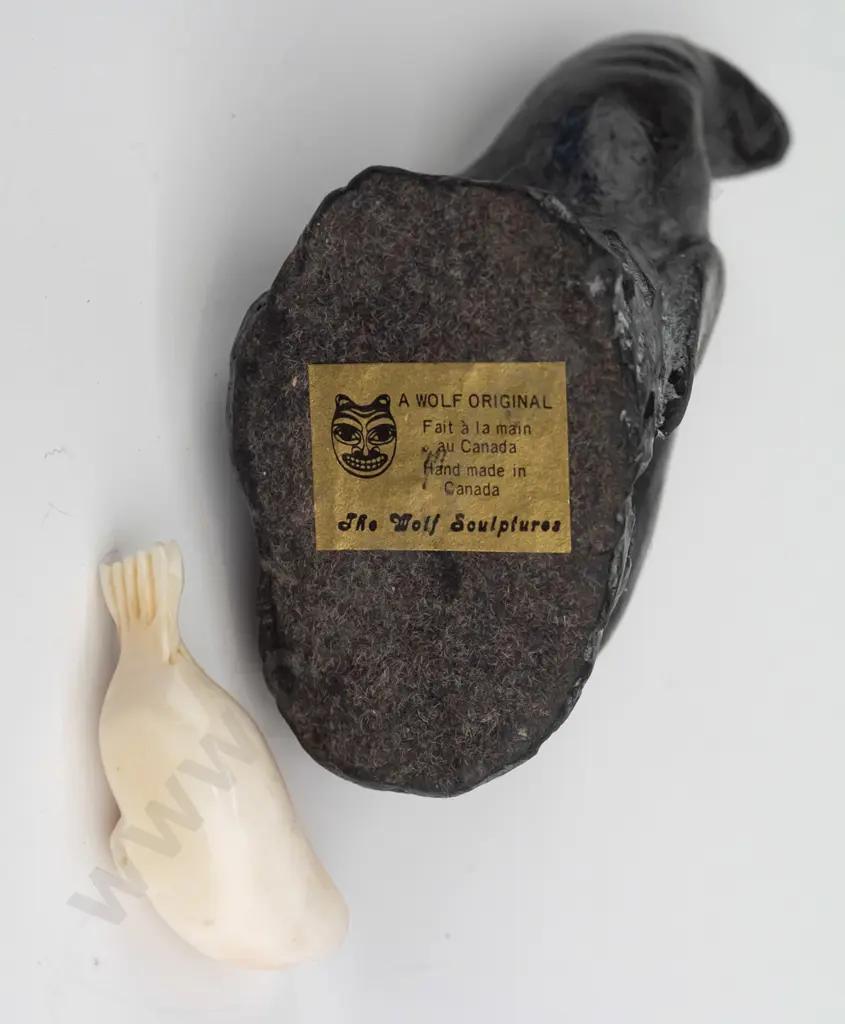 small carved bone? seal figure marked Robert Apatiki on base, and a carved black soapstone seal made in Canada H-80 Image 1++
