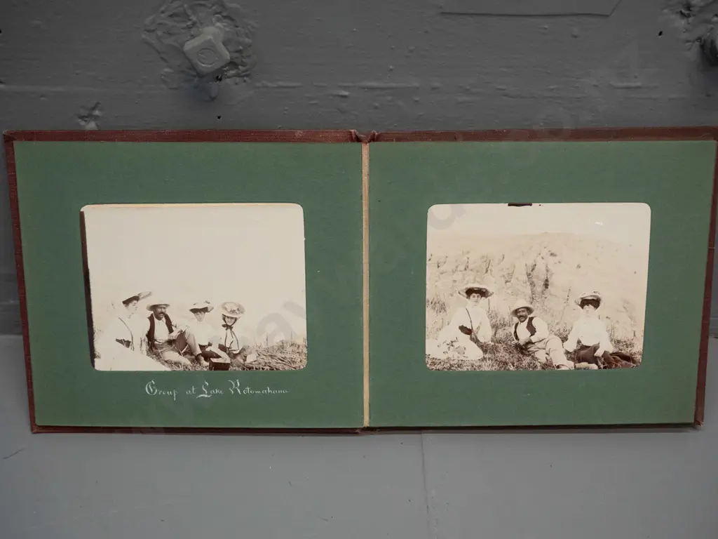 small vintage photograph album with mainly Rotorua tourist subjects, Lake Rotokakha, diving at Whaka Bridge, etc. Image 1++