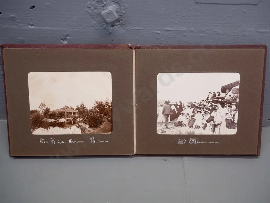 small vintage photograph album with mainly Rotorua tourist subjects, Lake Rotokakha, diving at Whaka Bridge, etc. Image 1++