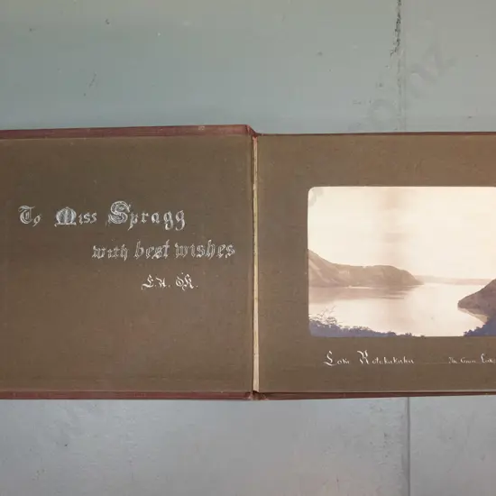 small vintage photograph album with mainly Rotorua tourist subjects, Lake Rotokakha, diving at Whaka Bridge, etc.