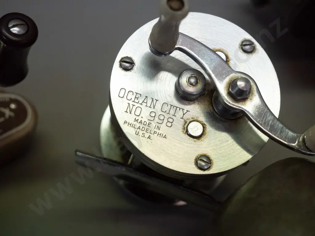 4 metal cased fishing casting reels - Young & Sons Ambidex, Harrington & Sons, Pezon & Michel Luxor France, and Ocean Image 1++
