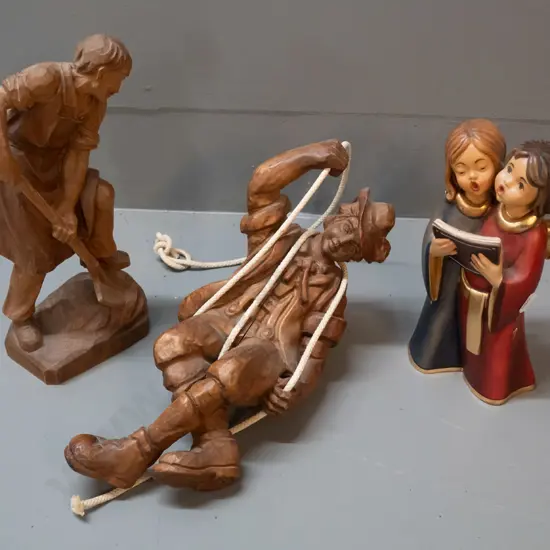 3 German carved timber figures - man with shovel, mountaineer on rope, and painted singing angel figure marked Bildhauer