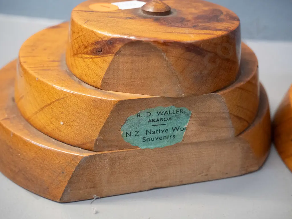 pair of figured kauri circular form book-ends with R.D. Waller Akaroa NZ native wood souvenirs label - one has a loose Image 1++