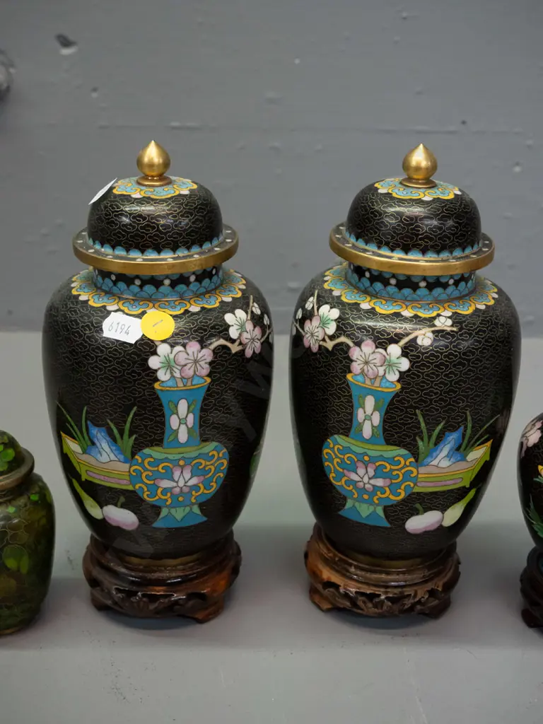 Chinese cloisonne ware - pair of black lidded temple jars on carved timber stands, small vase on stand, and small green Image 1++