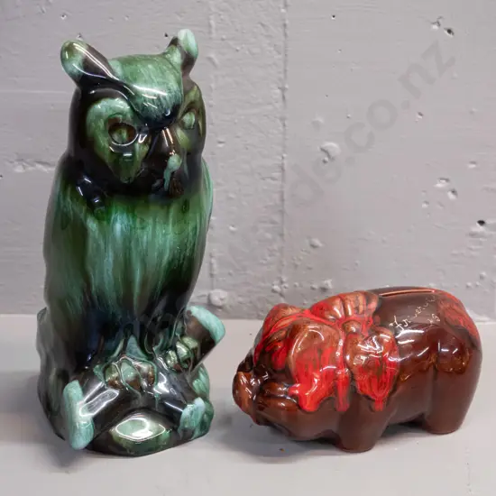 2 pieces of Blue Mountain pottery - orange trickle glaze piggy bank marked Fredericton N.B. and a teal glaze owl H-250.