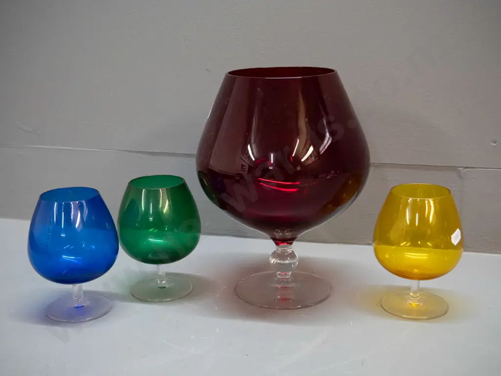 4 clear stemmed coloured glass items - large ruby goblet vase H-245 D-170 and 3 goblets - green, blue and yellow Image 1++