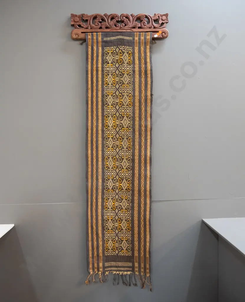2 Indonesian (Tenun Ikat) woven fabric wall hangings on carved timber hangers - some fraying and wear, fading, one has a Image 1++
