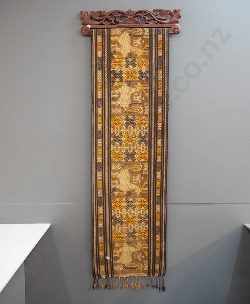 2 Indonesian (Tenun Ikat) woven fabric wall hangings on carved timber hangers - some fraying and wear, fading, one has a Image 1++