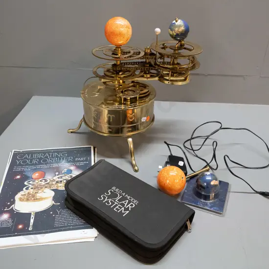 brass mechanical orrery / solar system model with moving earth and moon - with power supply, booklets, spare parts etc -