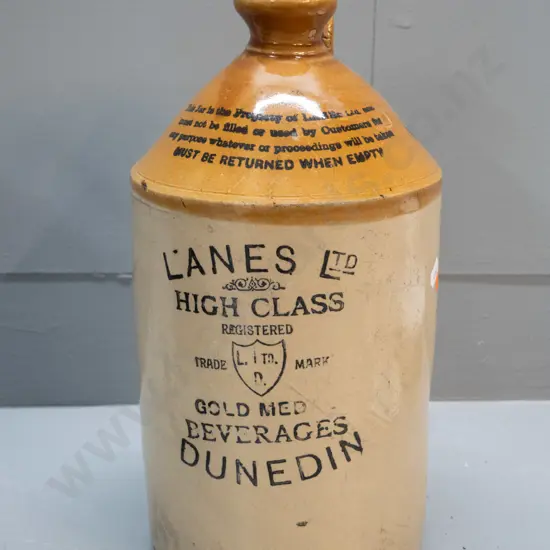 narrow mouth crock marked Lane's Gold Medal Beverages Dunedin, No. 5, with threaded timber stopper marked Lane's - big