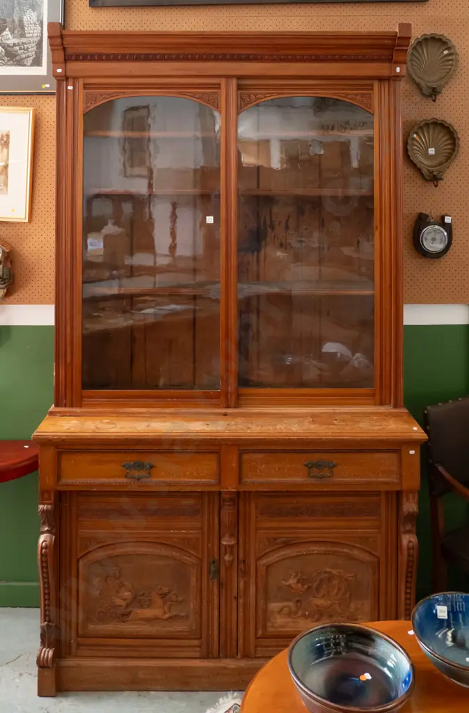 colonial rimu sideboard with bookcase top, 2 glazed sliding doors, 2 drawers with brass handles over 2 panelled cupboard Image 1++