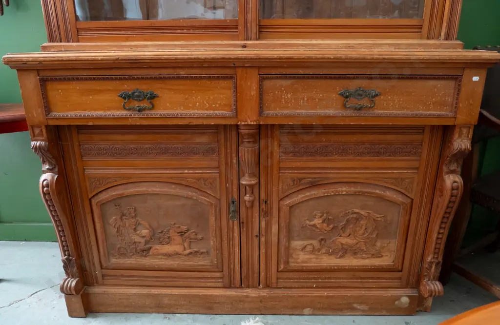 colonial rimu sideboard with bookcase top, 2 glazed sliding doors, 2 drawers with brass handles over 2 panelled cupboard Image 1++