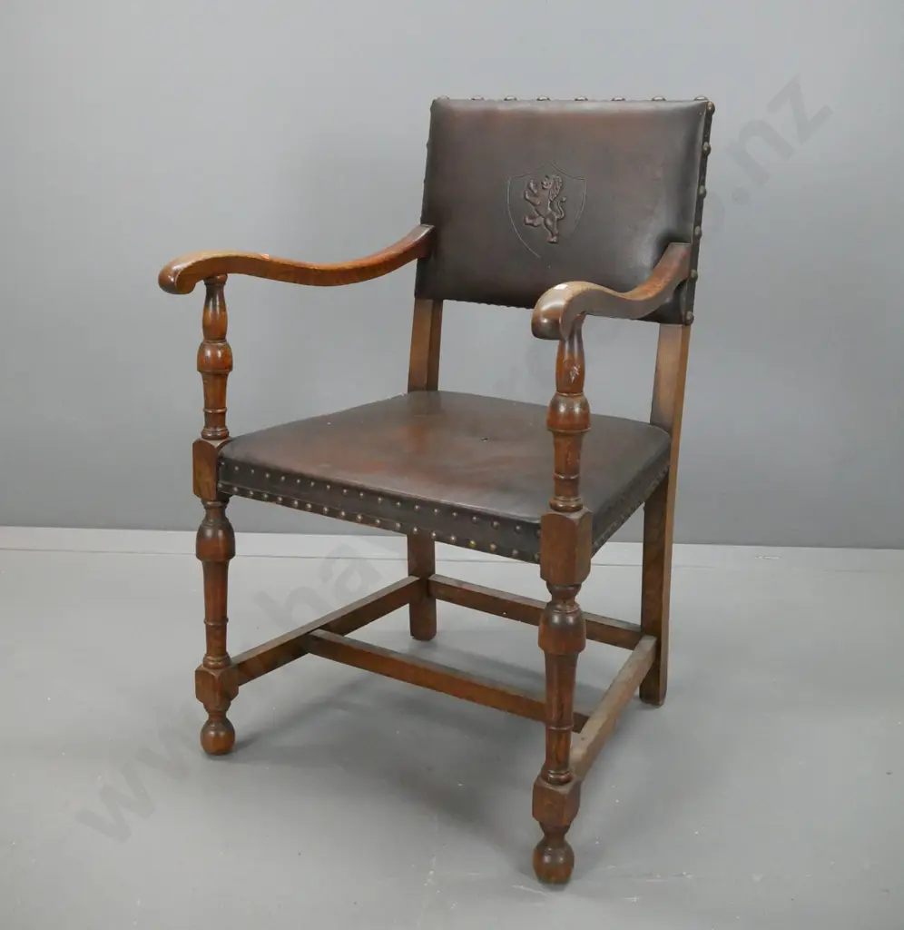 restorer's 1940s vintage oak armchair with stretcher base, brass studded edging to leather upholstery, shield & lion Image 1++