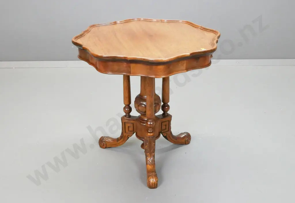 vintage walnut wine or occasional table with shaped edge top, cathedral 3-point base on 3 sweeping carved legs Image 1++
