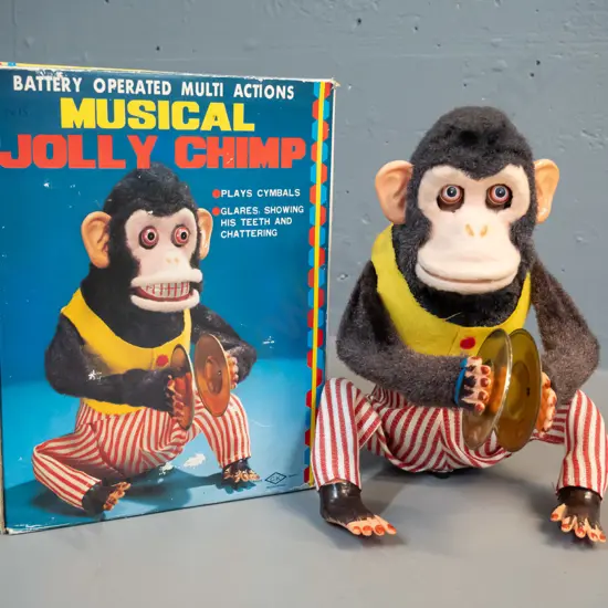 retro battery powered musical chimp toy with original box - untested, but battery compartment clean. H-250