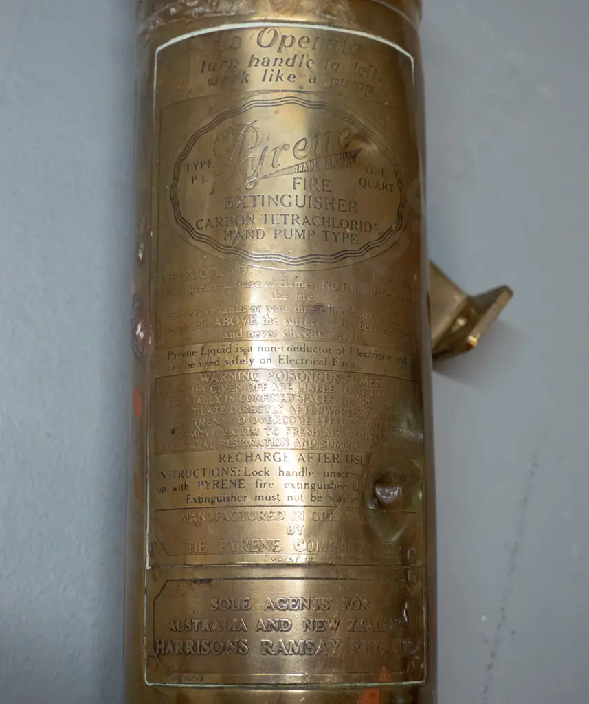 vintage Pyrene brass hand pump fire extinguisher with wall mounting bracket - made in England, marked Harrison Ramsay Image 1++