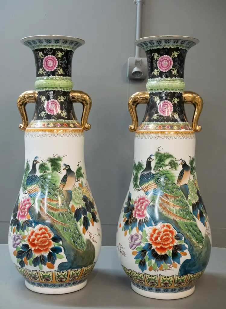 pair of very large pear shaped Chinese floor vases with gilt elephant head handles, raised peacock and flower motifs & Image 1++