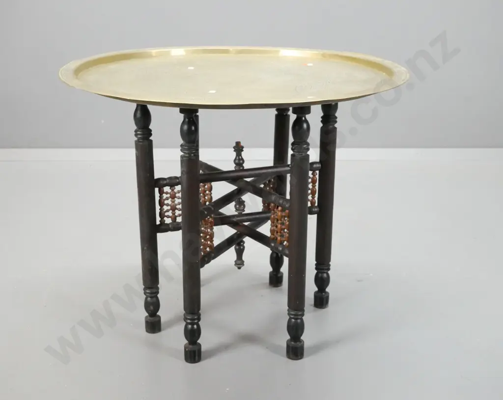 Indian brass tray table on ebonised timber collapsible base, turned shaped legs and turned leg support gallery - tray Image 1++