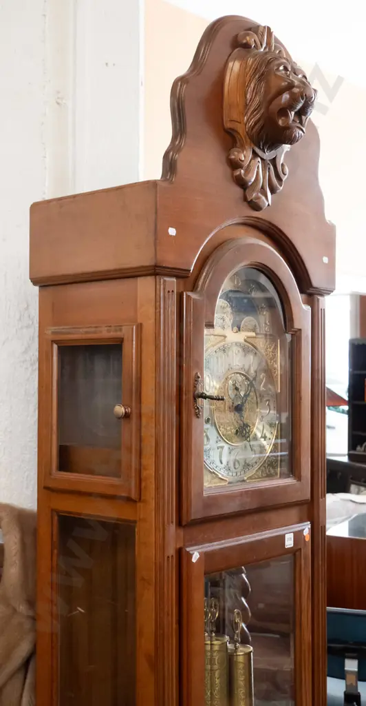 German large long-cased clock with /carved lion's head on shield top, arched glass door, 2 glazed doors to top, brass Image 1++