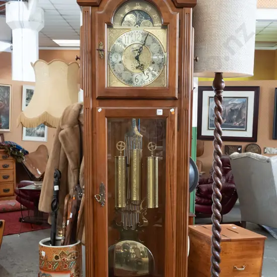 German large long-cased clock with /carved lion's head on shield top, arched glass door, 2 glazed doors to top, brass