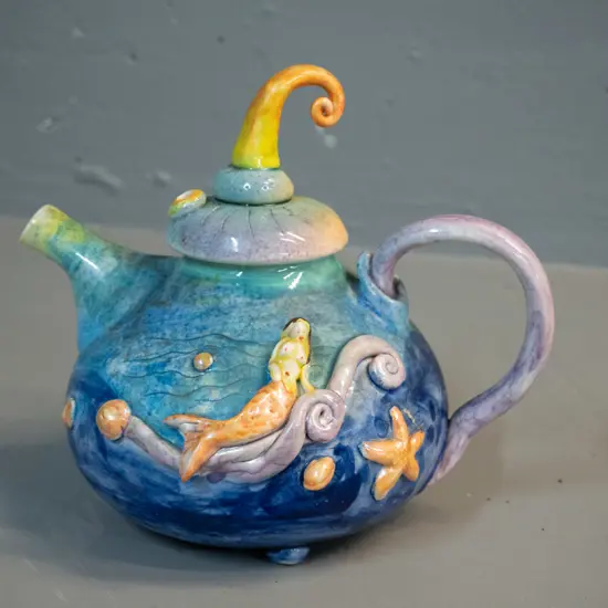 Marion Mewburn studio pottery teapot - mermaid and shell motifs H-190 W-190