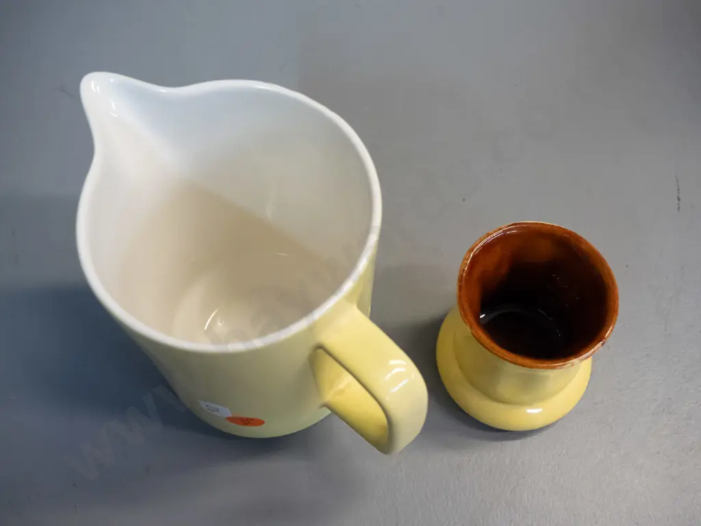 2 Crown Lynn yellow glaze items - small vase with brown interior and a milk jug with white interior with faint Made in Image 1++
