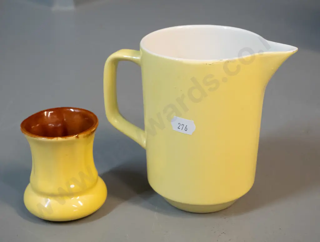 2 Crown Lynn yellow glaze items - small vase with brown interior and a milk jug with white interior with faint Made in Image 1++