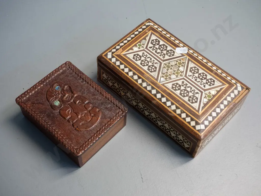 carved Maori motif timber lidded box with paua inset eyes and a middle eastern inlay jewellery box in restorer's Image 1++