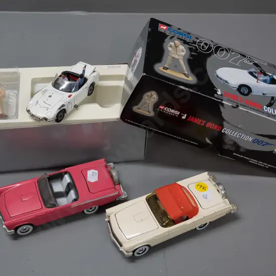 3 Corgi die-cast model vehicles -  2 older Ford Thunderbird convertibles and a boxed 1997 James Bond edition - box in