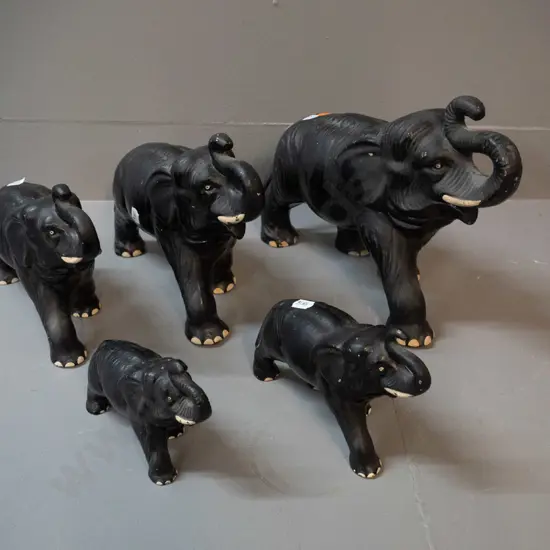 5 Sylvac black glaze elephant figurines - some glaze flecks, crazing, one of medium size has a repair. Largest is H220