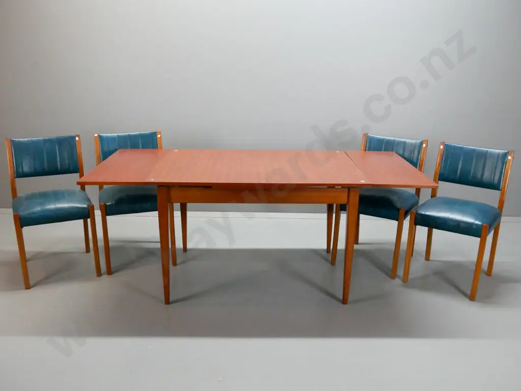 retro mahogany dining suite with 4 ribbed pattern teal vinyl covered chairs, draw leaf veneered top. 3 chairs have loose Image 1++