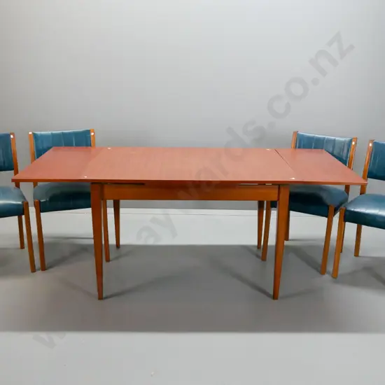 retro mahogany dining suite with 4 ribbed pattern teal vinyl covered chairs, draw leaf veneered top. 3 chairs have loose
