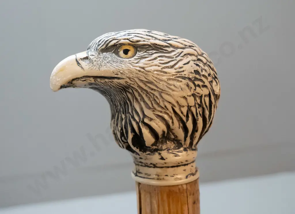 timber walking stick with (composite?) faux carved bone eagle head knob & brass tip - has split to timber L-910 Image 1++