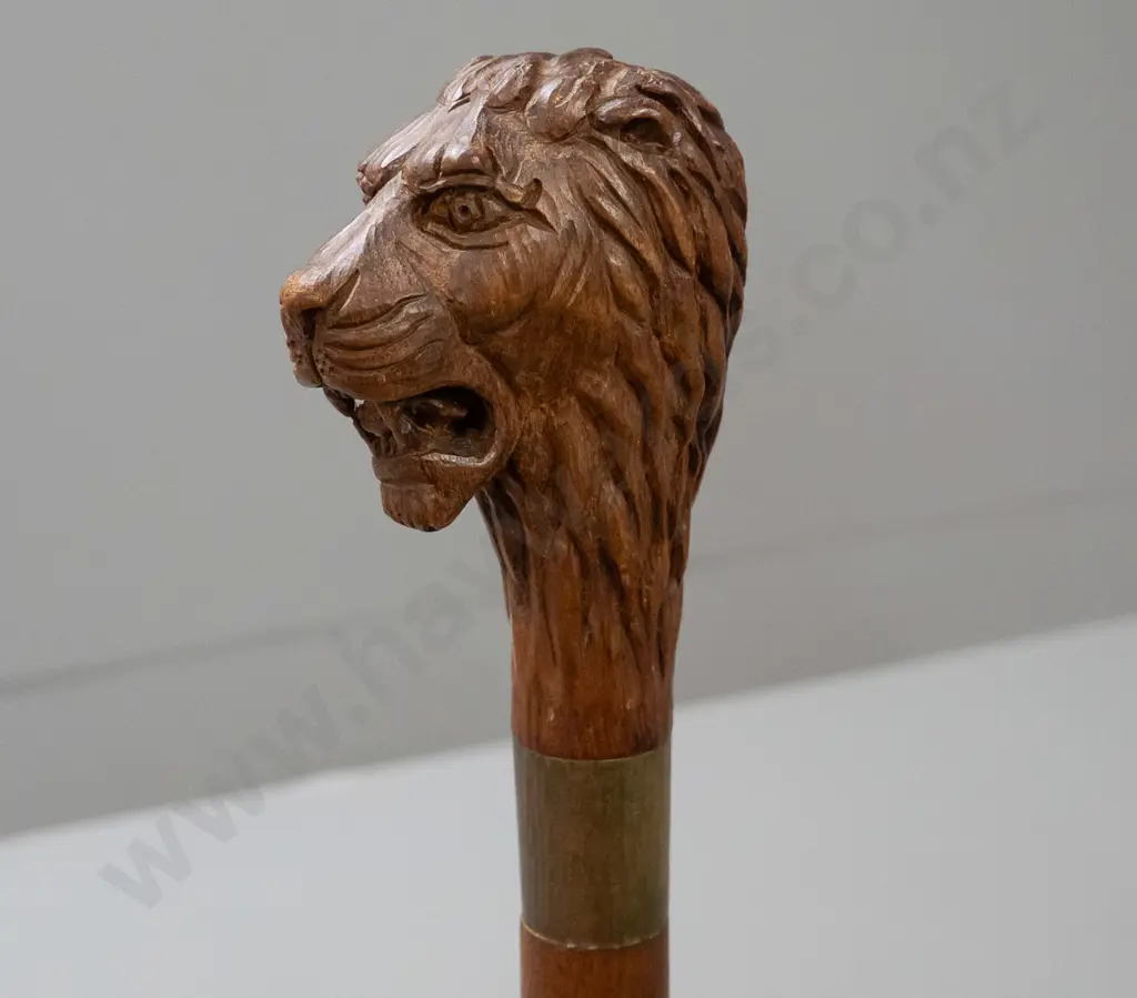 timber walking stick with carved lion head handle, beaten metal band, rubber tip L-885 Image 1++