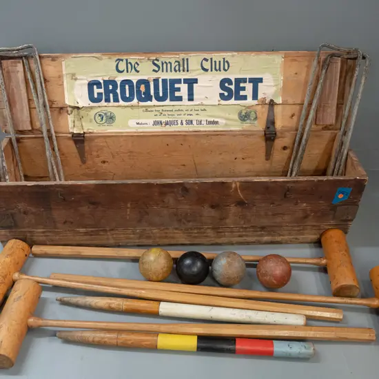 vintage croquet set in pine case with metal hinges and handles with 4 boxwood & hickory mallets, 4 balls, 6 iron hoops
