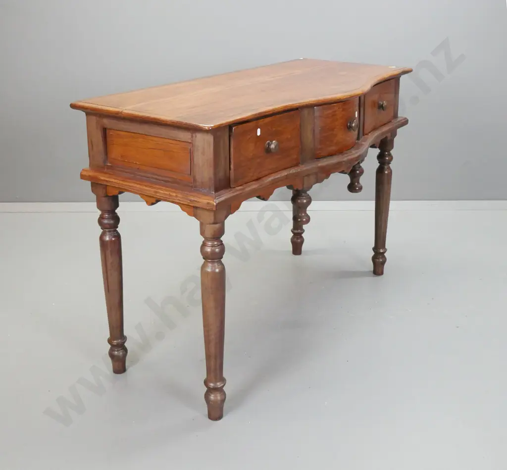 Asian teak serpentine fronted side or hall table with 3 drawers w/turned knobs, turned drop finials, on turned legs - Image 1++