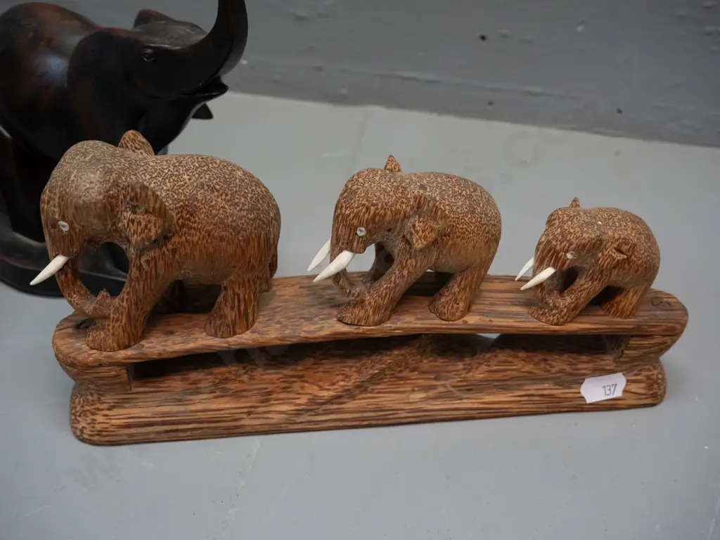 3 elephant figures - 2 small ebony with bone tusks, composite resin group of 3 and carved timber group of 3 with bone Image 1++