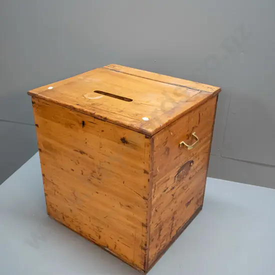 vintage kauri ballot box with hinged lid, brass side handles, non-functioning lock, marked NZ with broad arrow on top,