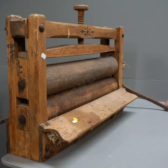 vintage mangle with timber frame and rollers, cast iron handle and fixings, screw bench bracket mounts.
