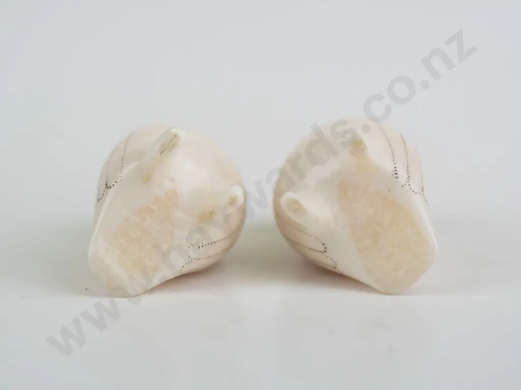 2 small carved bone? arctic owl figures with scrimshaw style feather designs, both marked Don Ungott on base. H-35 Image 1++
