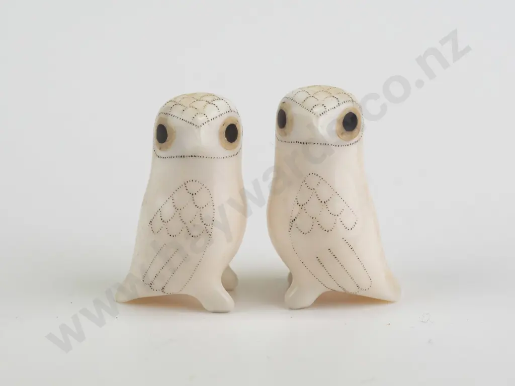 2 small carved bone? arctic owl figures with scrimshaw style feather designs, both marked Don Ungott on base. H-35 Image 1++