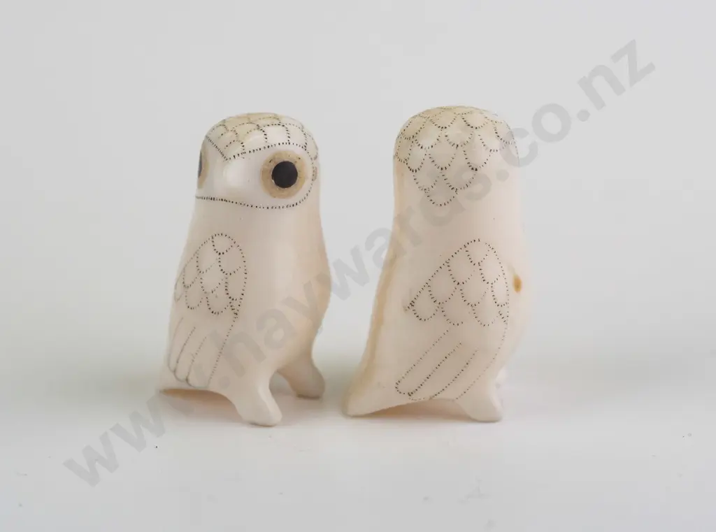 2 small carved bone? arctic owl figures with scrimshaw style feather designs, both marked Don Ungott on base. H-35 Image 1++