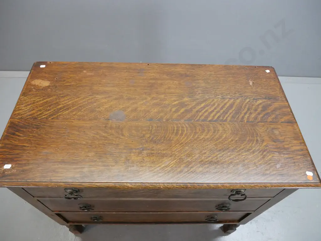 vintage oak chest of 3 drawers with metal drop handles, panelled plywood sides, stretcher base. Holes in top from Image 1++