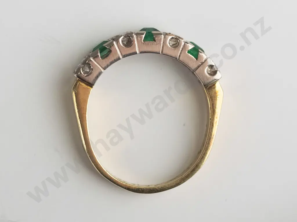 yellow gold ring with white gold bridge setting stamped 18ct 5.8grms greenstones [not tested] 4 diamonds 3.00 round Image 1++