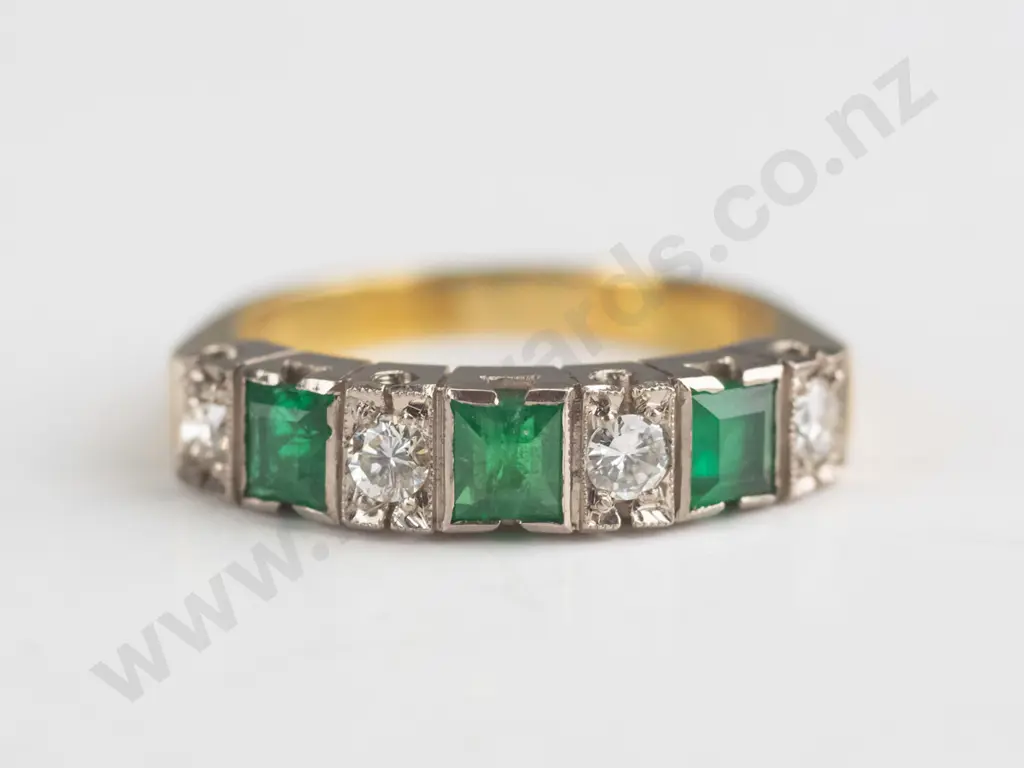yellow gold ring with white gold bridge setting stamped 18ct 5.8grms greenstones [not tested] 4 diamonds 3.00 round Image 1++